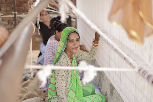Artisan crafting a saree
