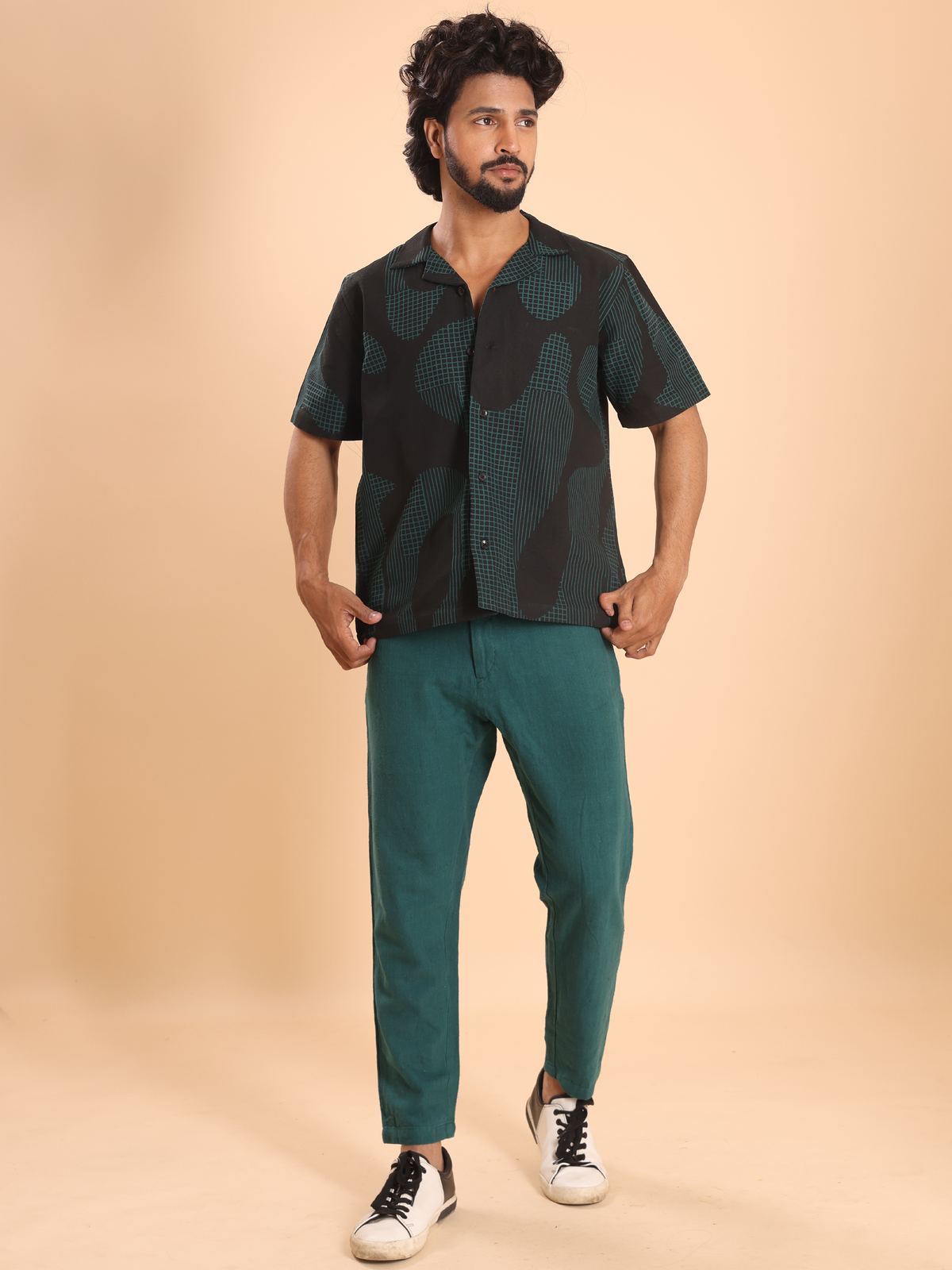Close-up of teal geometric print on men's cotton shirt
